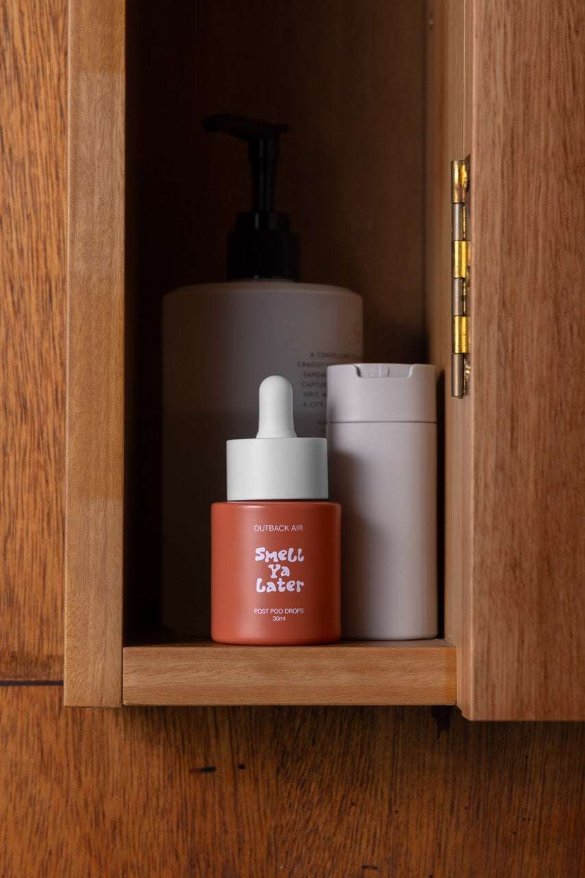 Three skincare products in a wooden cabinet with 'Smell Ya Later' text.
